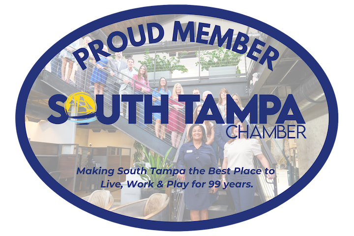 Oval badge with "Proud Member South Tampa Chamber" text, featuring a group of people standing on stairs. Below, it reads: "Making South Tampa the Best Place to Live, Work & Play for 99 years.